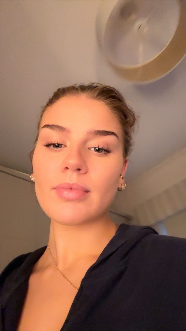 Natural close-up of Rachel with her hair tied back